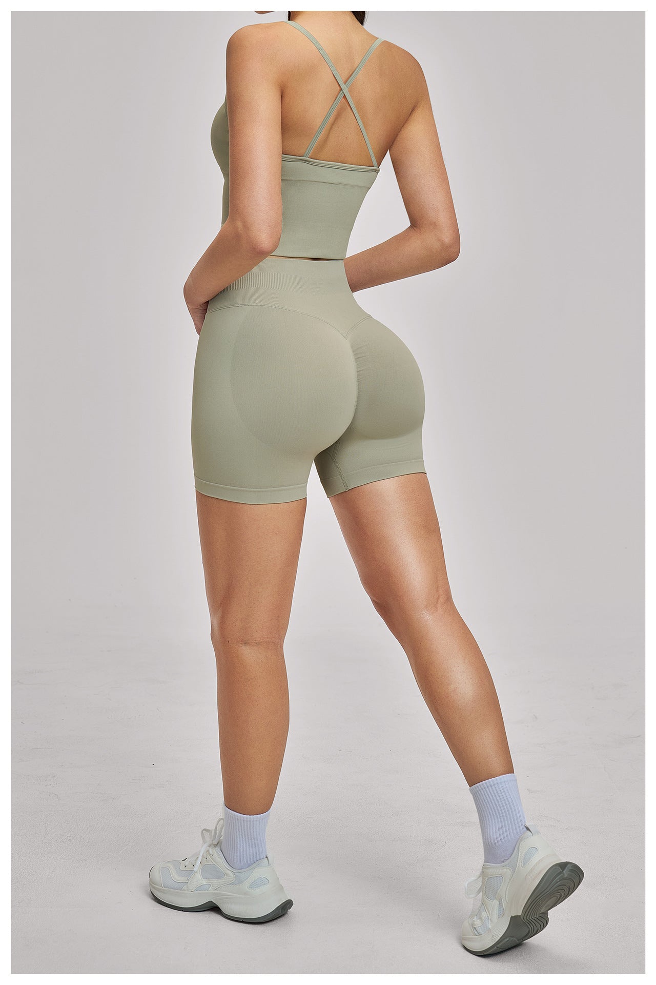 03/2026  Wholesale FOUREGG High-elastic running tracksuit with cross-back design, tight-fitting fitness wear, seamless yoga set for women, 5518