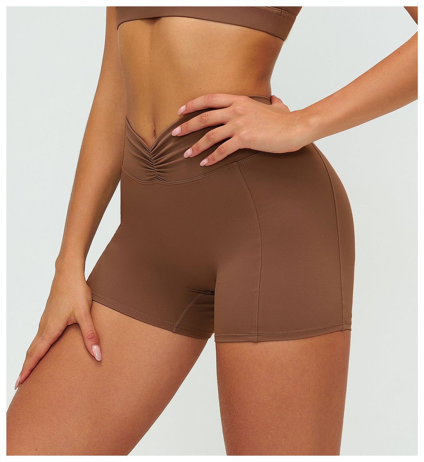 12/2025 Women's high-waisted, brushed yoga shorts with pleats and hip-lifting design, perfect for outdoor running and sports (style number 9313).