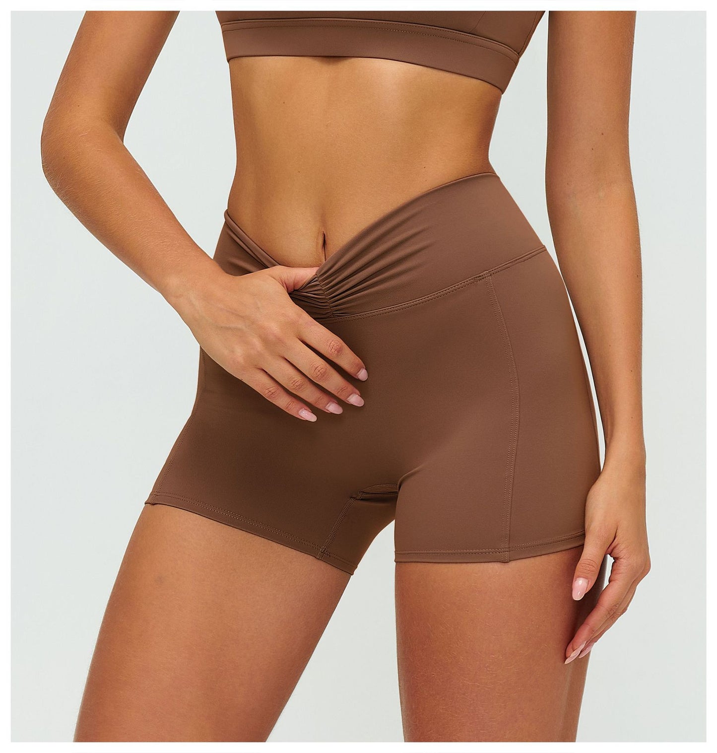 12/2025 Women's high-waisted, brushed yoga shorts with pleats and hip-lifting design, perfect for outdoor running and sports (style number 9313).